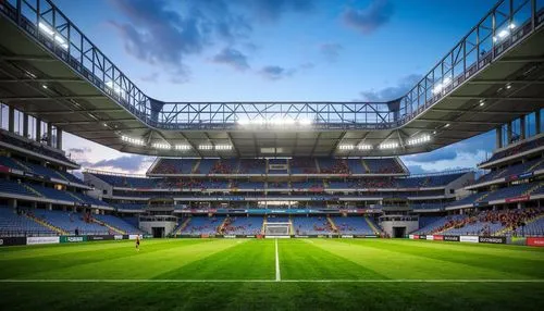 Football stadium, retractable roof, lightweight membrane structure, cantilevered upper tier, sleek metallic framework, tensioned fabric cladding, atmospheric lighting, vibrant team colors, lush green 