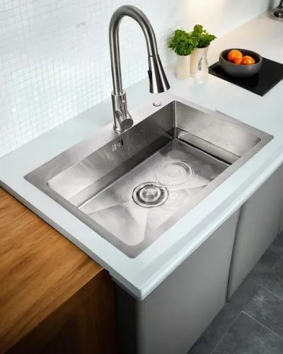 a kitchen sink with two oranges on a counter,mixer tap,electrolux,kitchen sink,gorenje,corian,whirlpool pattern