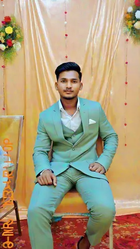 man in green suit sits on stool posing for picture,shaadi,nawroz,sangeeth,welcome wedding,wedding frame,golden weddings,nazmul,bridegroom,hamied,eidsivating,sangeet,nijaz,burhanuddin,imtiyaz,majlis,ab