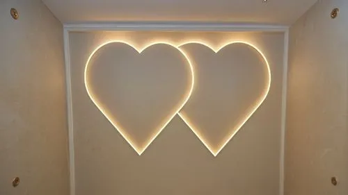 Gypsum decor in the ceiling of a room with hidden lighting, real decor,two heart - shaped lights hanging on a wall in a bathroom,wall light,wall lamp,heart shape frame,light sign,neon valentine hearts