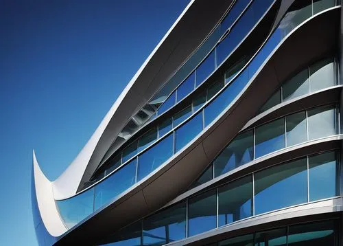 Modern building design, futuristic architecture, Shellharbour, coastal city, Australia, curved lines, sleek glass facade, metallic structure, silver roof, triangular shapes, cantilevered floors, ocean