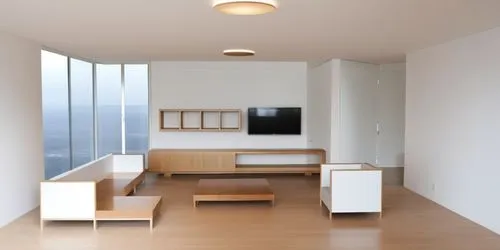 hay un televisor de color negro en la pared del fonto y los muebles aereos son de madera,las 2 lamparas de techo son redondas luz blanca,a room with some benches and tv,modern room,anastassiades,moder