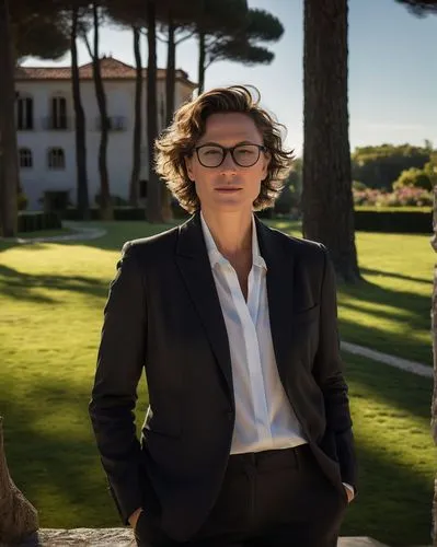 Abbey Wambach, modern architect, mature lady, short curly brown hair, minimal makeup, elegant black blazer, white shirt, high-waisted dark gray trousers, designer glasses, standing confidently, hands 