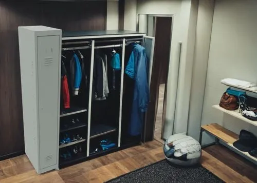 a locker is shown in an organized room,wardrobes,walk-in closet,minibar,storage cabinet,wardrobe,lockers