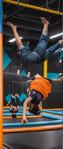 Capture the harmony of play and gravity-defying stunts at Nova Trampoline Park in captivating photos.,bouldering mat,horizontal bar,gymnastic rings,gymnastics room,vault (gymnastics),climbing hold,cir