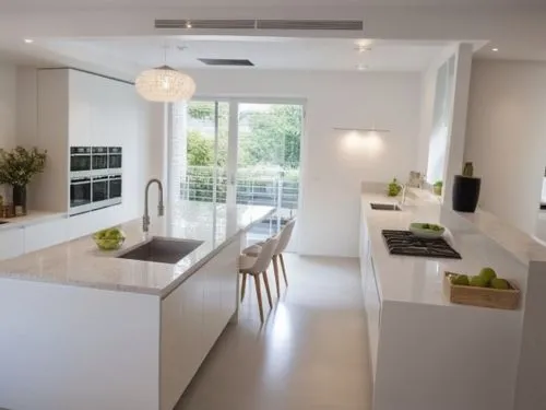 A kitchen design featuring only smooth, handleless cabinet fronts in pure white color. The cabinets have clean, modern lines, creating a minimalist and sleek aesthetic. The overall feel is one of orde