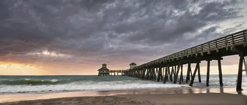 Juno beach fishing pier during a stormy sunrise over atlan for Juno fishing report,scripps pier,old pier,fishing pier,burned pier,ponte vedra beach,grand haven,wooden pier,south carolina,the pier,crom