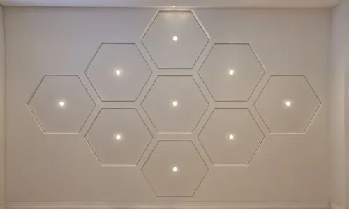 
I want to convert this layout to a real gypsum decoration in the ceiling of a room
I want the hexagonal sector to appear lower than the ceiling level of the room.,a white room with some lighting up t