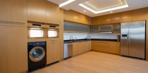 Modern kitchen with Esparanzo oak cabinets and black granite countertop. Profile handles are installed in the bright cabinets to instill a look of minimalist style, overall theme is bright and airy wi