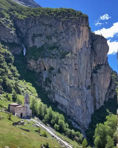 Sanctuary of San Besso, built with a side wall adjacent to the monolithic rock of Mount Fautenio. It is located in Valle Soana, a valley on the southern slope of the Gran Paradiso massif. Gran Paradis