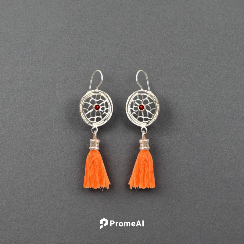 two earrings lie on a white background, top view of the earrings,teardrop beads,jewelry florets,earrings,enamelled,christmas tassel bunting,earring,martisor,watercolor tassels,traffic cones,jewelry ma