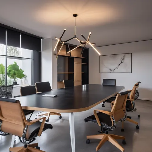 meeting room with white stucco walls and microcement flooring, with a table with a black lacquered top and dark wooden legs in the center, eight chairs with wheels with metal structure and seat and ba