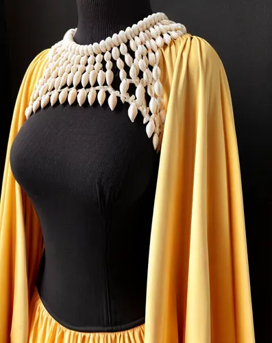 bodice,abaya,garment,blouse,raw silk,knitting clothing,drape,dress form,evening dress,yellow and black,openwork,women's clothing,gold filigree,one-piece garment,breastplate,scalloped,bolero jacket,sheath dress,shawl,collar