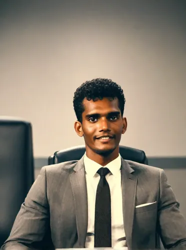 black businessman,a black man on a suit,blur office background,mohammed ali,maldivian rufiyaa,social,mahendra singh dhoni,suit actor,maldives mvr,ceo,black professional,devikund,thavil,real estate agent,african businessman,benagil,stock exchange broker,silambam,financial advisor,businessman