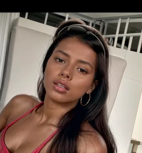 You can see her whole body.  She is lying at home on the sofa.  Lazy lying position.  She wears gray shorts and a shirt.,panamanian,mugdha,angolan,taraji,filipina,liliyana,filipino,trinidadian,sirotka