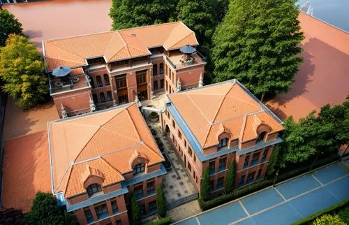 an aerial view of an english style building,red brick,bird's-eye view,mirogoj,marylhurst,terracotta tiles,view from above,frombork,aerial view,monastery of santa maria delle grazie,collegiate basilica