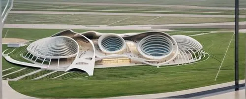 birds eye view of a completely indoor sports facility. the volleyball facility intends to be dynamic and curvilinear with differences in height. this facility spans 120 meters for reference,futuristic