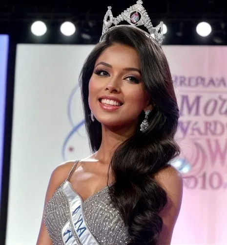 She stands on the stage at the "Miss World" awards ceremony, she is in first place, with a diamond crown on her head.  She gets excited and sheds a tear.  Picture from the newspaper,a miss usa contest