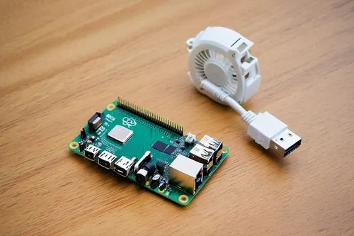 Raspberry Pi, mini computer, ARM Cortex-A53 CPU, 1GB RAM, microSD card slot, HDMI port, USB ports, Ethernet port, compact size, circuit board, electronic components, wires, tiny fan, heat sink, DIY pr