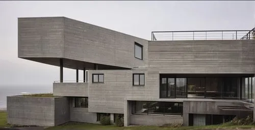dunes house,modern architecture,exposed concrete,cubic house,modern house,cube house,concrete construction,danish house,concrete ship,concrete,beach house,frame house,residential house,brutalist architecture,metal cladding,arhitecture,reinforced concrete,concrete blocks,house shape,corten steel,Photography,General,Realistic