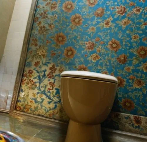 yellow wallpaper,bathroom accessory,bathroom,shower curtain,bathroom tissue,luxury bathroom,commode,chamber pot,bathtub accessory,toilet table,floral pattern,moroccan pattern,toilet,ceramic tile,damas