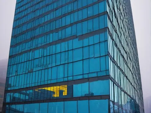 Big, blue, modern, futuristic, sleek, glass, steel, curved, angular, geometric, Vancouver, WA, cityscape, metropolitan, urban, skyscraper, high-rise, commercial building, office tower, reflection, pud