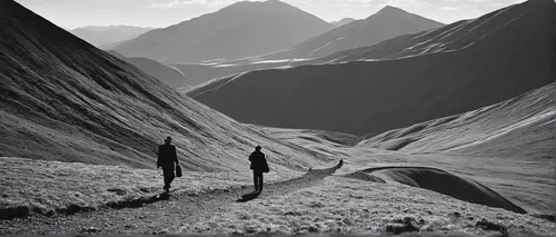 grayscale photo of two people walking on mountain valley,great aletsch glacier,alpine route,morteratsch glacier,the pamir highway,grosser aletsch glacier,bernese oberland,the pitztal glacier,mountaine