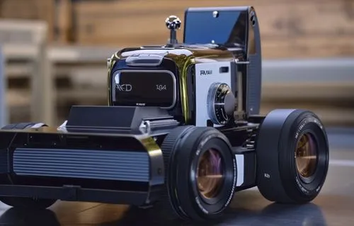 there is a camera truck model on the table,walle,lawn mower robot,radio-controlled car,twin lens reflex,rolleiflex,rc model,Photography,General,Realistic