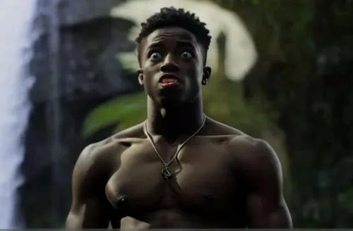 the boy has his mouth and eyes wide open, in amazement!!!,a young man with  on standing in front of water,djourou,boakye,tempa,bakayoko,adebayor,eboue