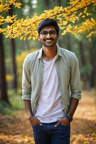 Young Indian man, Vishnu Prasad, 25 years old, strong facial features, black hair, short beard, brown eyes, glasses, casual wear, white shirt, dark blue jeans, sneakers, standing, relaxed posture, han