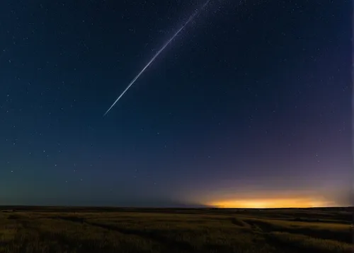 A flaring satellite, possibly and Iridium, over the oold pioneer Larson Ranch in the Frenchman River Valley in Grasslands National Park, Saskatchewan. <br /> <br /> This is a stack of 7 images taken a