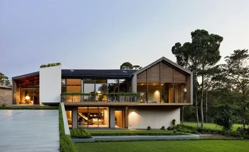 WHITE THEME, WHITE CLADDING EXTERIOR,TALL TREES IN THE BACKGROUND,modern house,modern architecture,beautiful home,timber house,dunes house,house shape,residential house,luxury home,asian architecture,