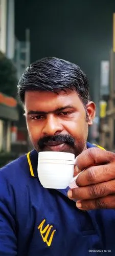 man in blue jersey drinking coffee from cup,murali,rajendar,kanth,rajesh,aravindan,vijaykumar,shivakumar,kannan,muralitharan,manoharan,manickam,ramkumar,raghu,venkat,srikumar,ranjith,saikumar,karthike