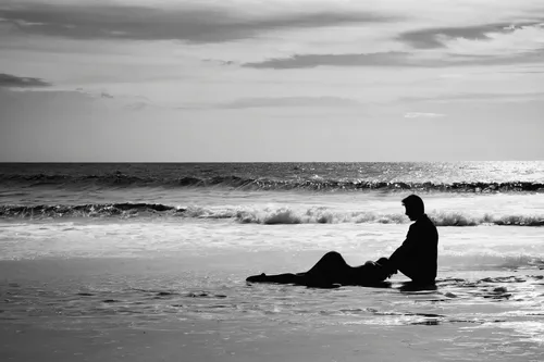 man at the sea,loneliness,solitude,contemplation,monochrome photography,the shallow sea,contemplative,praying woman,longing,dark beach,solitary,ebb,woman praying,contemplate,the endless sea,ruminating,boy and dog,still transience of life,beachcombing,the people in the sea,Illustration,Black and White,Black and White 33