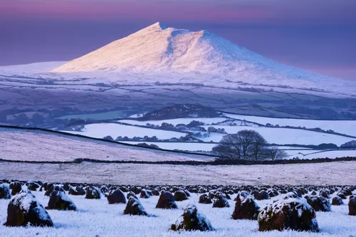 Second snows on the Welsh hills, and a dusted icing across the rounded summit of Moel Eilo, as seem from Anglesey.,brecon beacons,northern ireland,helens,snowy landscape,snowy mountains,snow landscape