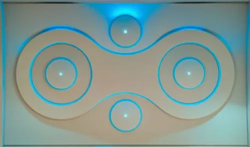 
Gypsum decoration in the ceiling of a room with hidden LED lighting,this decorative piece of artwork is made up of blue circles and circular lines,om,portal,gallifreyan,wall lamp,roundels,eckankar,Ph