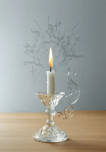 Candlestick placed on the table in the old castle

,a candle sits on the table in front of the light,spray candle,tea candle,candleholder,candle holder,christmas candle,votive candle,Photography,Black