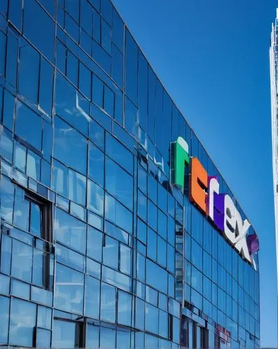 FedEx, architectural, modern, commercial, urban, cityscape, skyscraper, steel frame, glass facade, minimalist, clean lines, geometric shapes, abstract patterns, LED signage, vibrant colors, day time, 