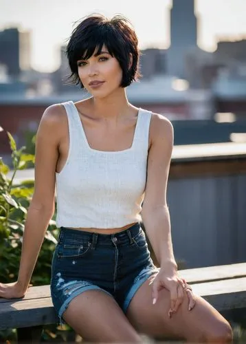 Jet black hair, pixie cut, messy texture, choppy layers, side swept bangs, bold eyebrows, subtle freckles, natural makeup, soft blush, glossy lips, slender neck, petite chest, fitted white tank top, h