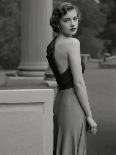 A lady from the 1940s in front of a classical column.,a woman in a black dress posing next to a pillar,ingrid bergman,olivia de havilland,hayworth,maureen o'hara - female,stabenow,stanwyck,Photography