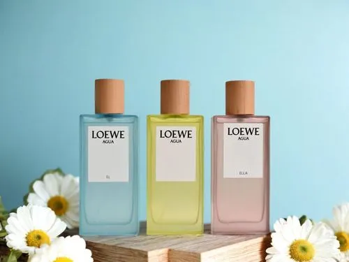 three small bottles with flower petals next to them,loewe,lakme,lavoine,lotions,iovine,flower essences