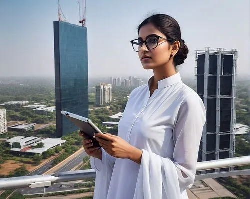 3D architecture designer, Indian woman, 25yo, Punjabi features, dark hair tied in a bun, minimal makeup, glasses perched on nose, white salwar kameez, black heels, holding a tablet and pencil, standin