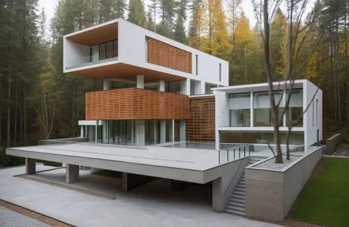 modern building with glass facade,cubic house,forest house,modern architecture,cantilevers,modern house,house in the forest,timber house,cube house,bohlin,cantilevered,dunes house,architektur,cube sti