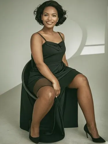 A self-confident woman smiles at the camera,woman in black dress sitting on a chair,mazibuko,mtetwa,mandisa,nkoana,thandeka,ikpe,Photography,Black and white photography,Black and White Photography 01