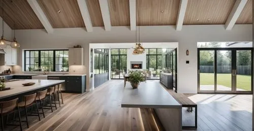 KITCHEN OVERLOOKING SUNROOM WITH DINING TABLE. TO THE LEFT A AWNING WINDOW OVERLOOKING OUTDOOR BARBEQUE SPACE AND TO THE RIGHT A LARGE PATIO DOOR OVERLOOKING PATIO STAIRS AND BEAUTIFUL GARDEN
,a kitch