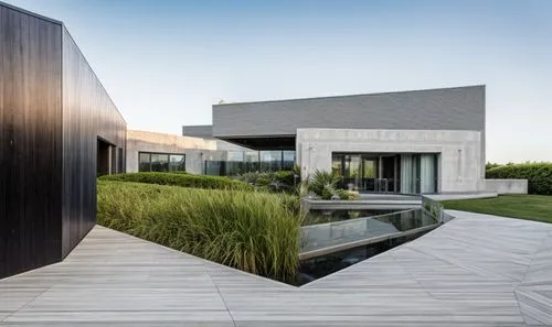 corten steel,dunes house,modern architecture,modern house,cube house,mirror house,cubic house,glass facade,landscape design sydney,archidaily,house by the water,glass wall,cube stilt houses,residentia