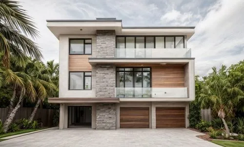 modern, brown wood, gray stone, white smooth stucco, lush tropical landscaping, driveway with cars in front
,modern house,florida home,modern architecture,contemporary,dunes house,two story house,mode