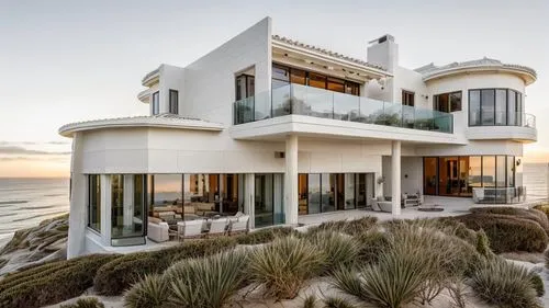 Nestled along the coastline of Florida, a breathtakingly beautiful White Stucco House Style with brown mix terracotta roof commands a panoramic view of the ocean, and large waves, perched majestically