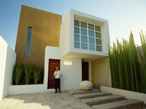 a man standing on a porch of a modern building,dunes house,modern house,cubic house,3d rendering,cube house,model house,Photography,General,Realistic