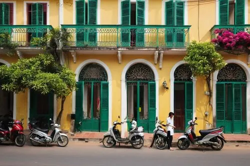 Hanoi French colonial architecture, grandiose building, yellow walls, green shutters, ornate balconies, intricate ironwork, red-tiled roofs, arched windows, wooden doors, vintage street lamps, motorbi